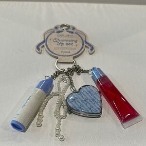 NWT Celavi (4) Piece lip Set with Bag Charm. Includes Lip Oil, Lip Balm etc.